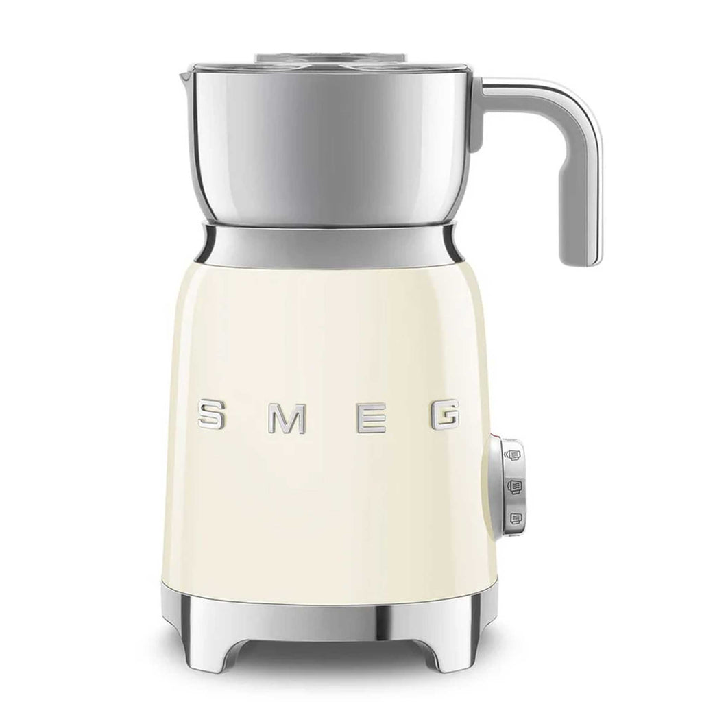Cream-colored milk frother with metallic accents on a white background