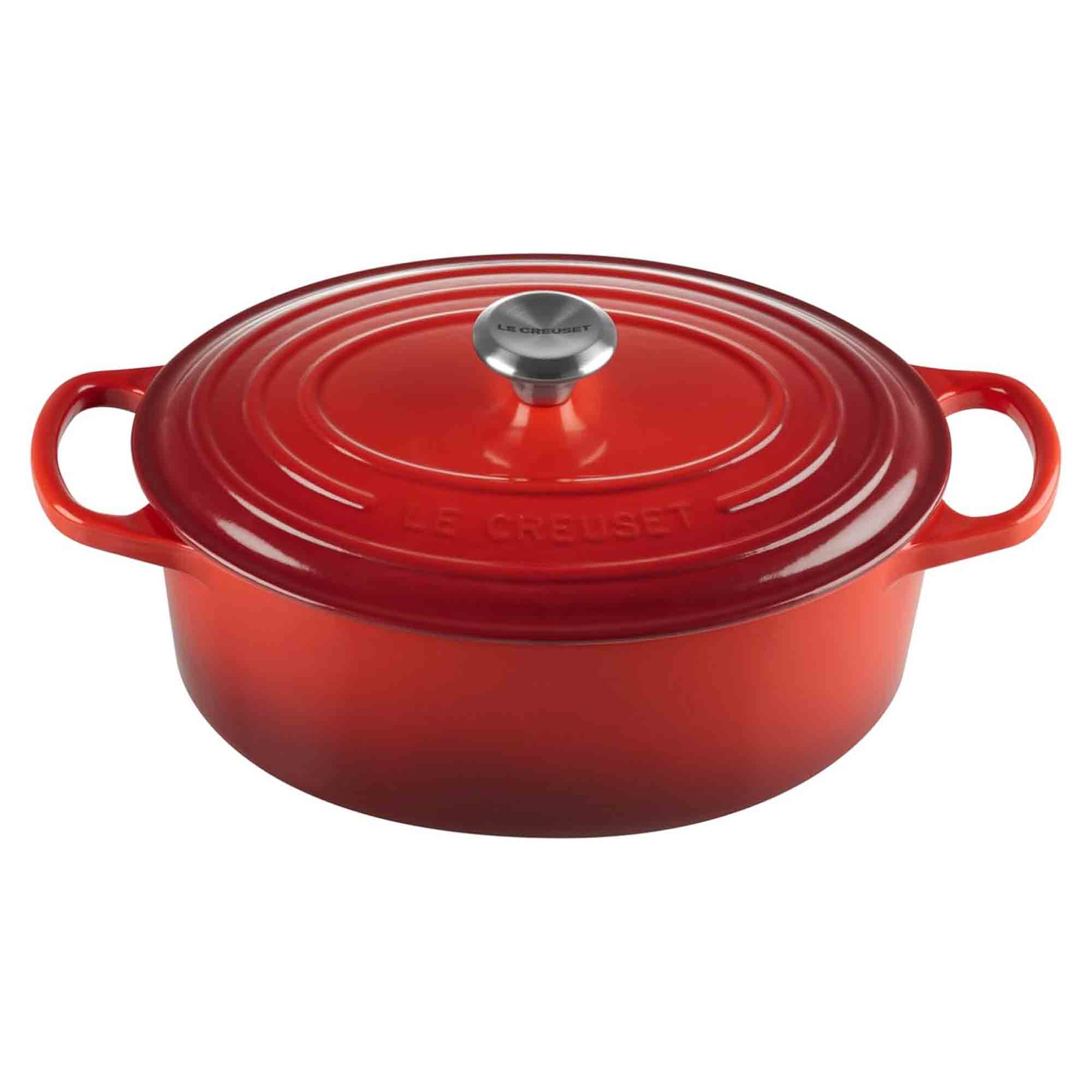 Cerise cast ironoval casserole with lid on a white background