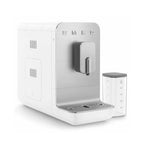 White coffee machine with a clear water tank on a white background, featuring the Smeg brand.