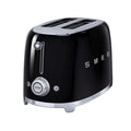 Black Smeg toaster with silver accents on a white background