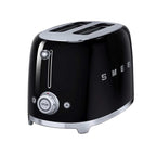 Black Smeg toaster with silver accents on a white background