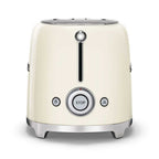 Cream-colored toaster with silver accents on a white background