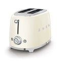 Cream-colored toaster with metallic accents on a white background