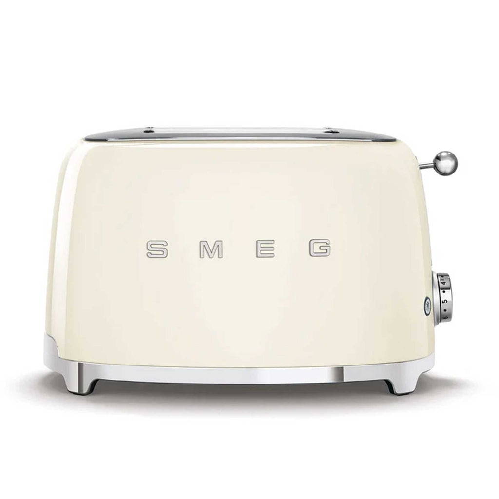 Cream-colored toaster with 'SMEG' branding on a white background