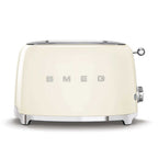 Cream-colored toaster with 'SMEG' branding on a white background