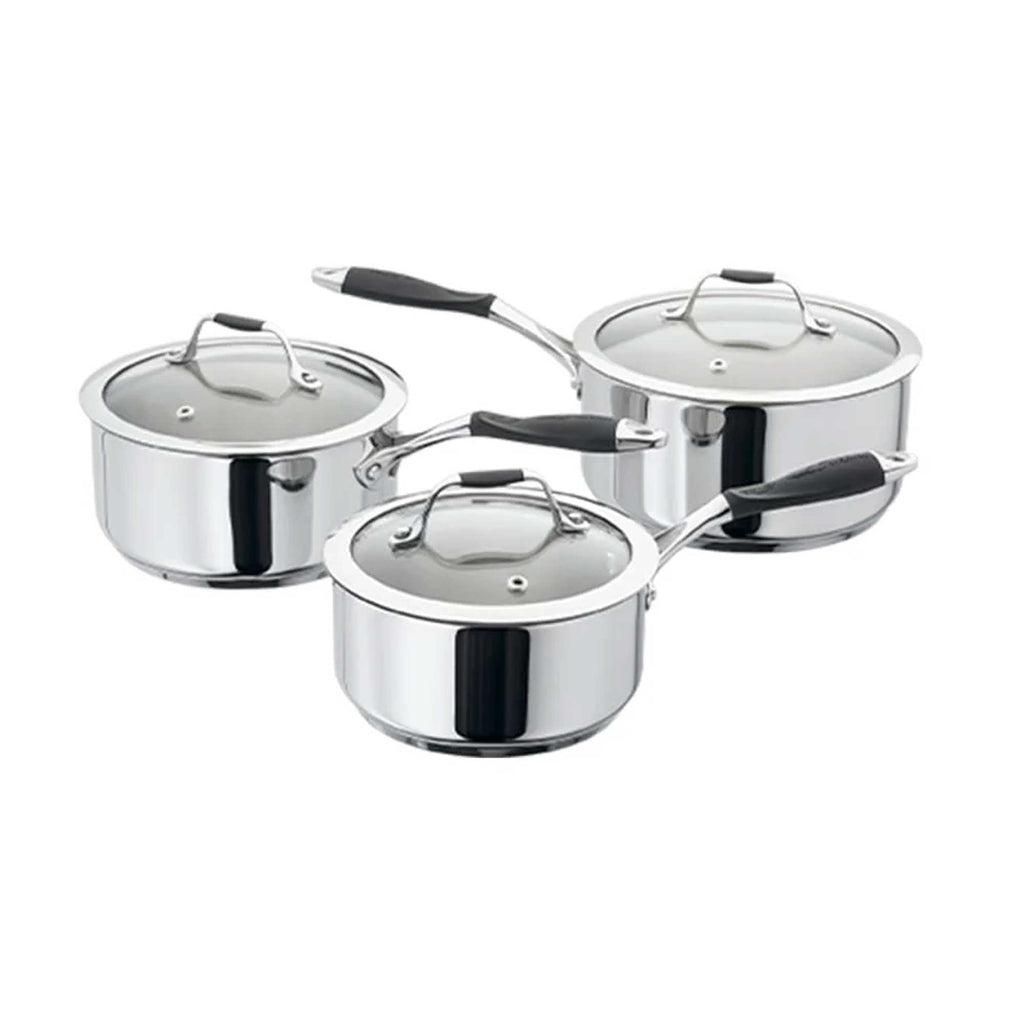 Silver saucepans on white background