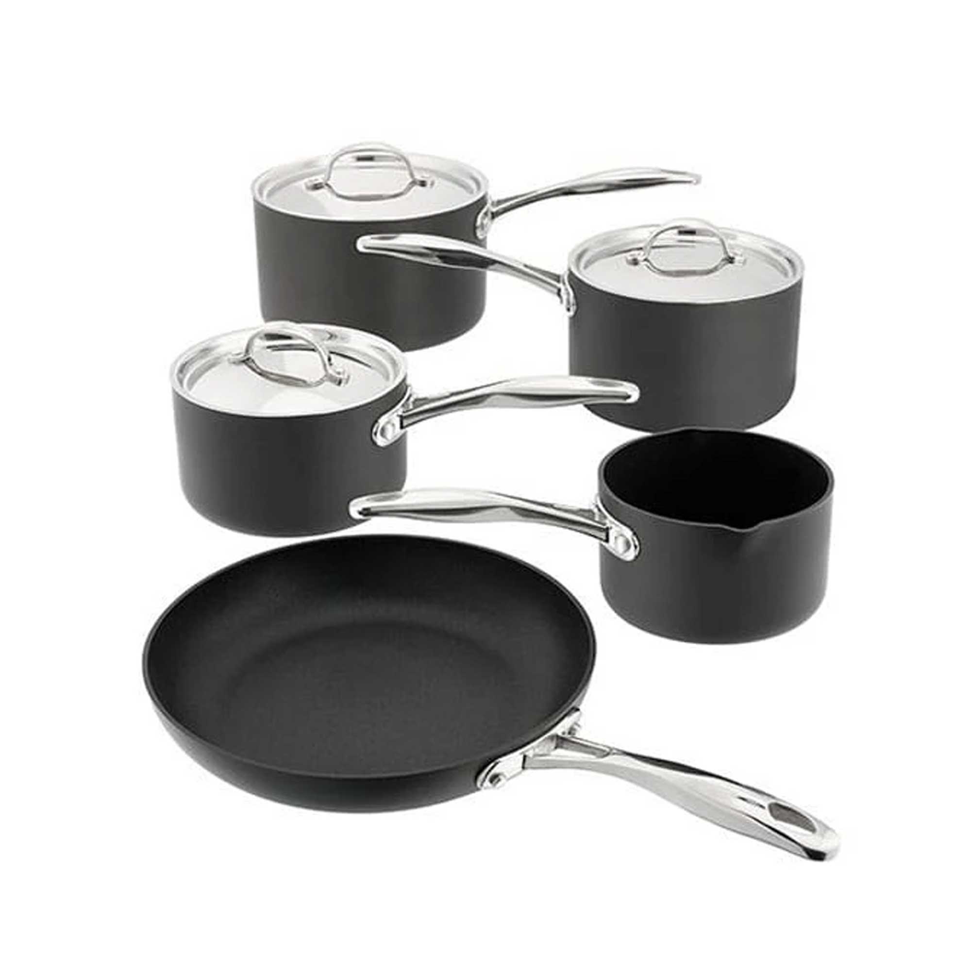 Black saucepan set with silver lids on white background