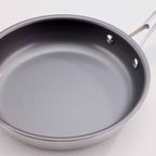 A gray non-stick frying pan with a silver metal rim and handle, shown on a clean white background.