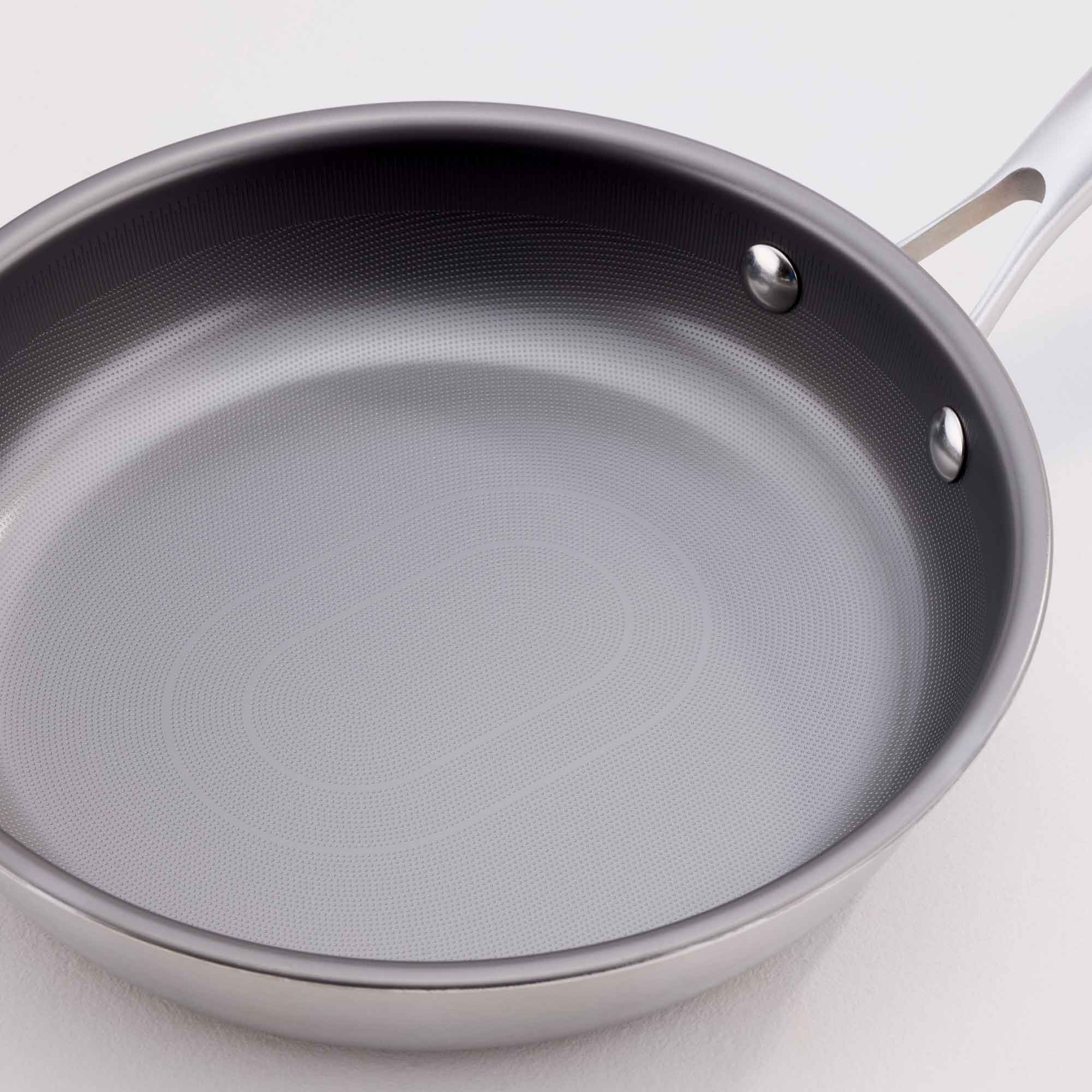 A gray non-stick frying pan with a silver metal rim and handle, shown on a clean white background.