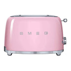 Pink toaster with 'SMEG' branding on a white background