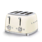 Cream-colored toaster with metallic accents on a white background