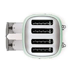 Pastel green toaster showing bread slots and crumb tray on a white background