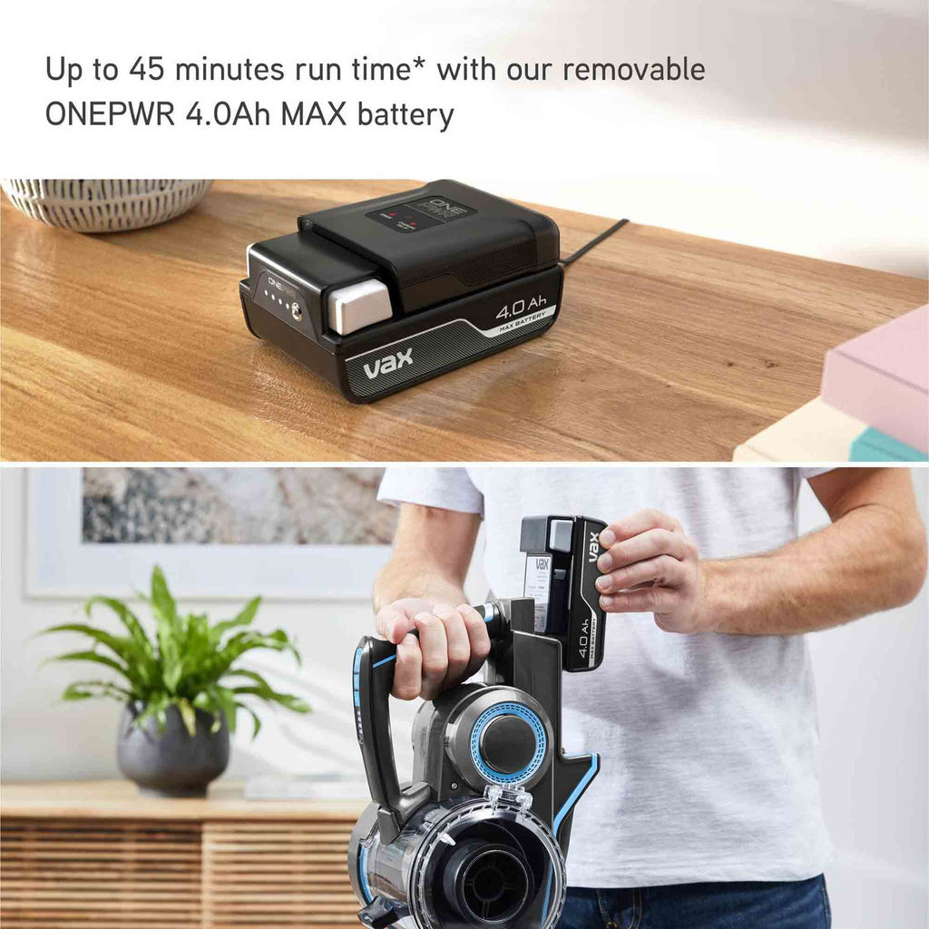 Vax vacuum cleaner battery pack on a wooden table with a person holding a vacuum cleaner.