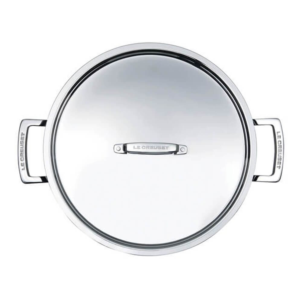 Stainless steel sauteuse lid with Le Creuset logo on a white background