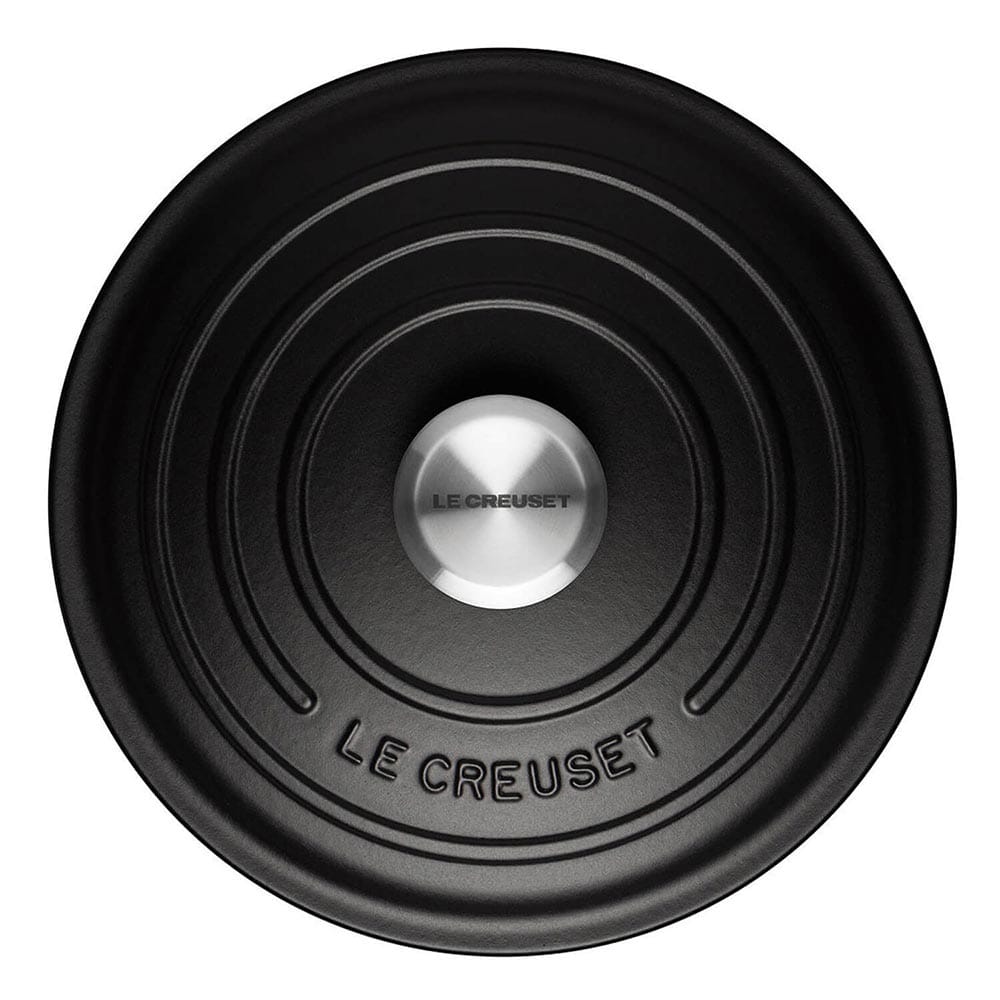 Satin Black Le Creuset casserole lid on a white background