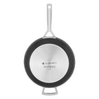 Black frying pan with a white label on a white background