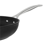Black frying pan with a silver handle on a white background