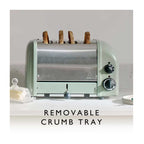 Green toaster with four slices of bread on a white countertop, featuring a removable crumb tray text.