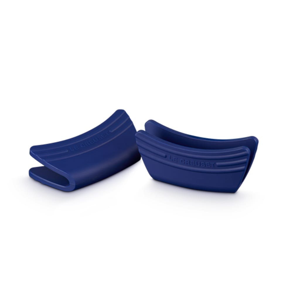 Two blue silicone baking molds on a white background