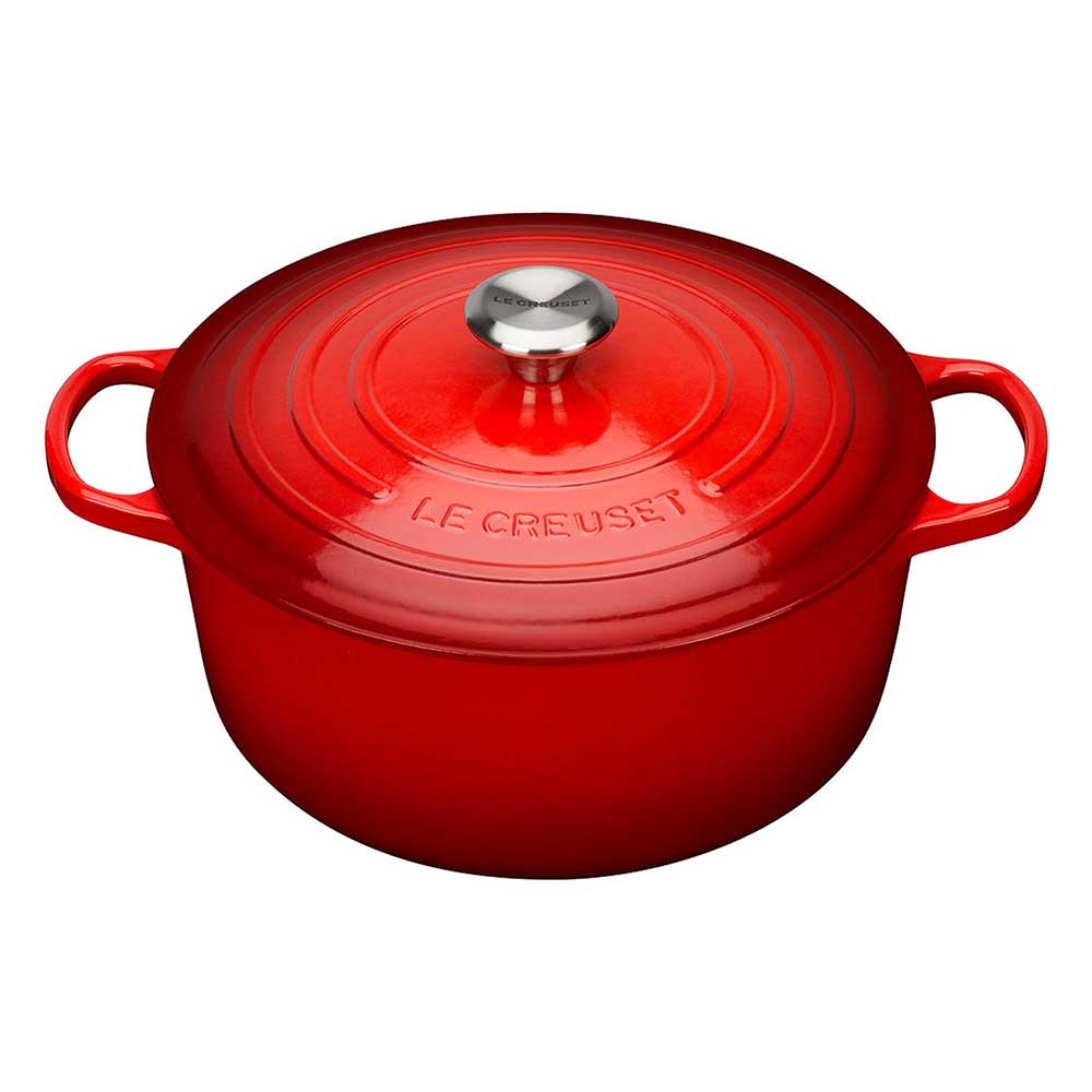 Cerise Le Creuset cast iron casserole on a white background