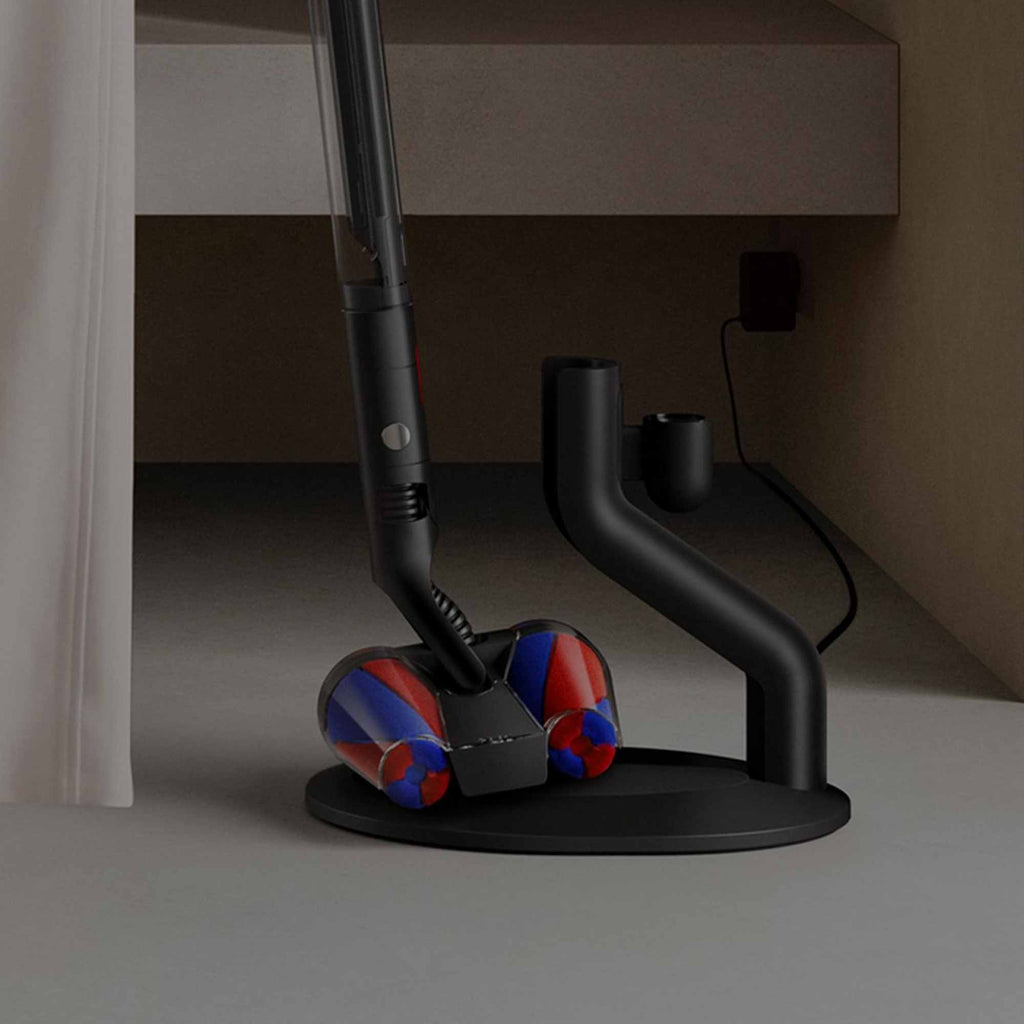 The PencilVac being placed onto its storage and charging dock.