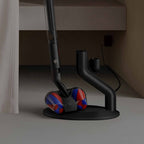The PencilVac being placed onto its storage and charging dock.